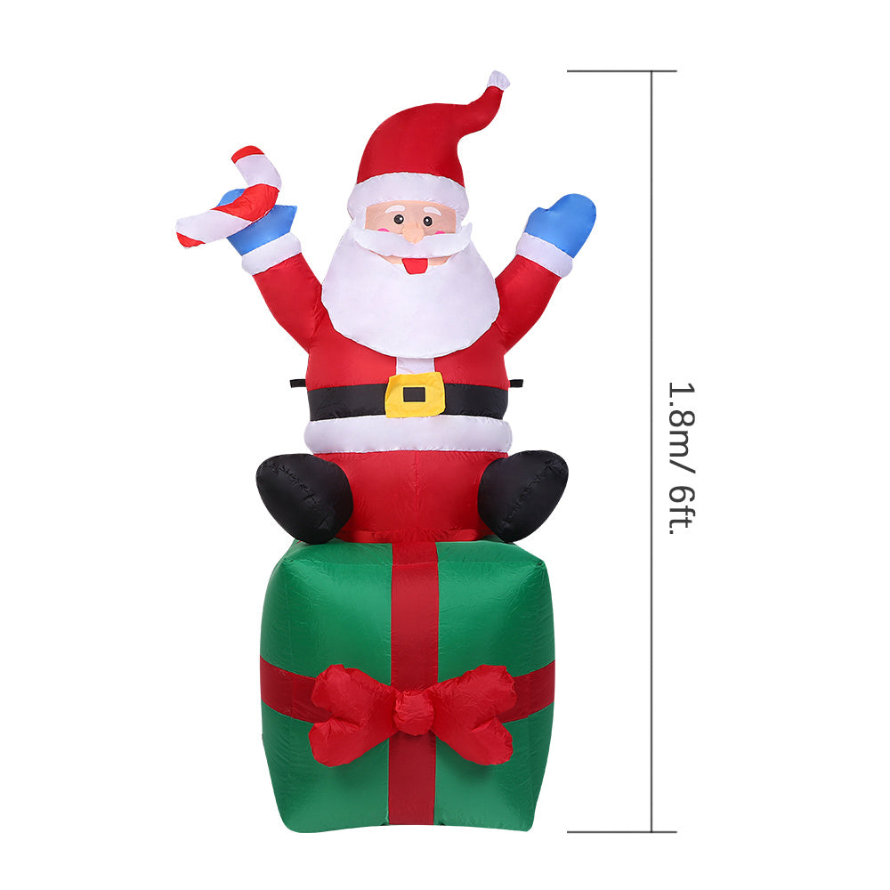 6 Feet Christmas Inflatable Santa Claus Carry Gift Giant Lighted Inflatable Christmas Decoration Xmas Holiday Blow Up Party Display with Fan Blower Ground Stake Ropes Water Bag